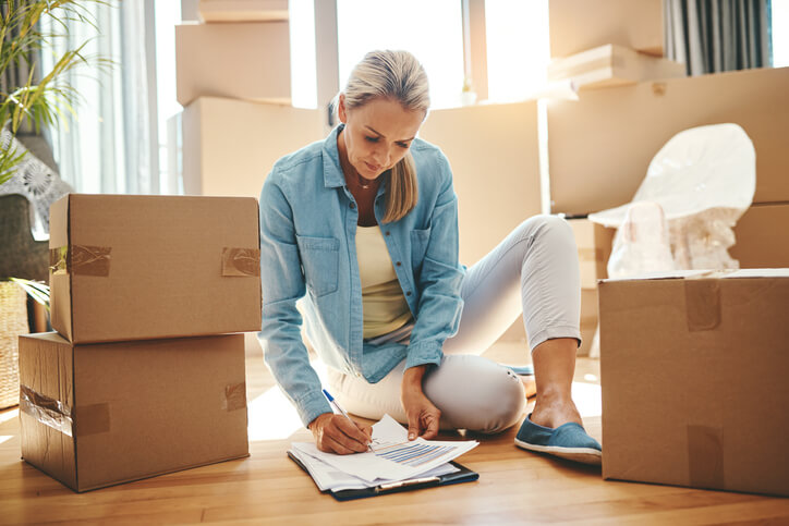 woman checking off packing list