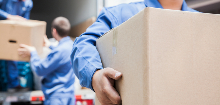 men carrying boxes from a truck